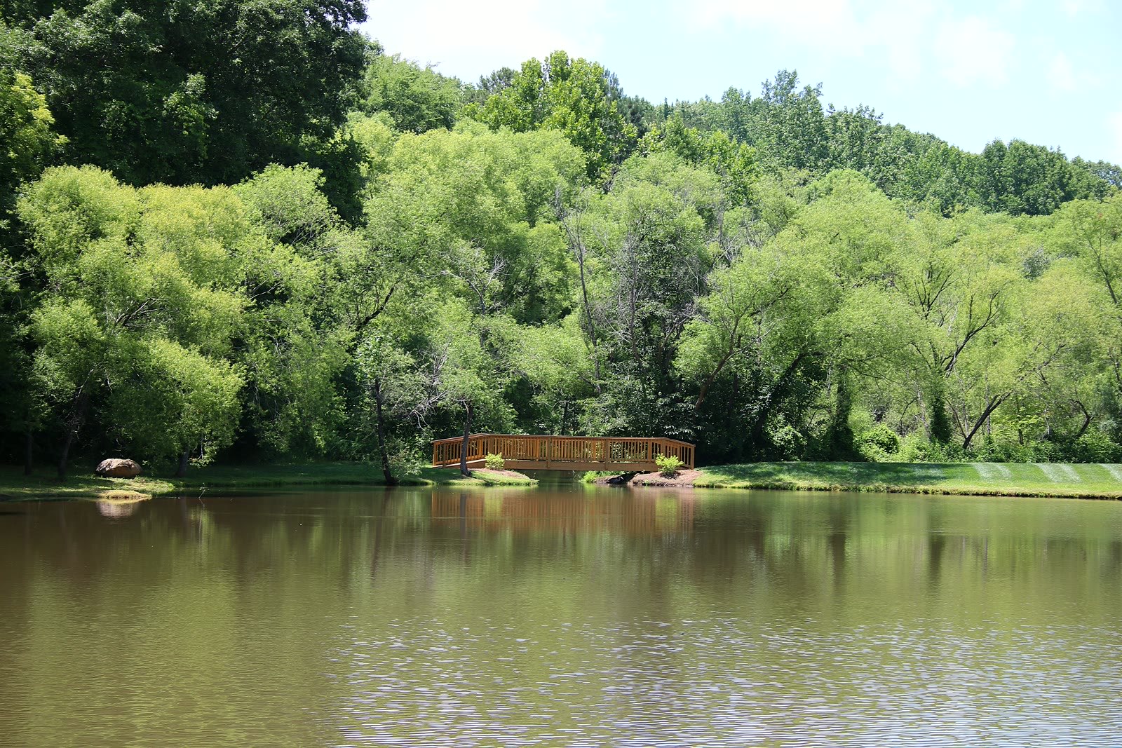 The wooden footbridge across the community pond